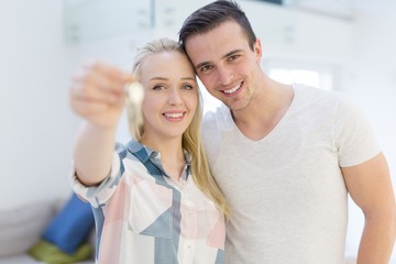 Wall Mural - couple showing a keys of their new house