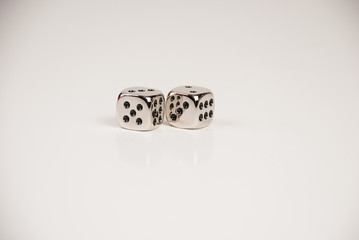 A pair of silver dice