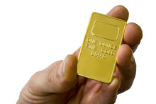 A Small Ingot Of Gold In The Hand. One Ounce Of Gold. Show Gold.