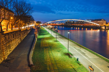 Bernatka Footbridge Over Vistula River In The Night In Krakow, Poland
