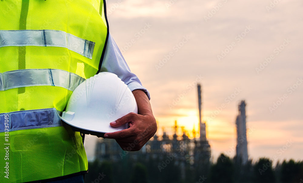 ภาพถ่าย Stock Engineer or Safety officer holding hard hat with ...