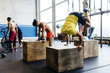 © ADDICTIVE STOCK - People training handstands on cubes