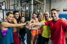 Sportive People Stacking Hands