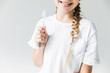 © LIGHTFIELD STUDIOS - child holding toothbrush