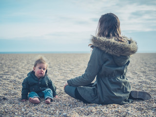 Wall Mural - Mother with baby on the beach