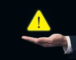 © andranik123 - Hand holding warning sign.