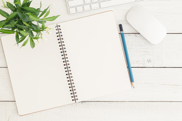 Wall Mural - flat lay photo of office desk with mouse and keyboard,empty open notebook on white wood table top vi