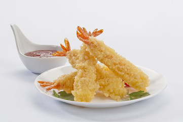 Tempura Jumbo Shrimps with salad and salsa dip on white plate and white background