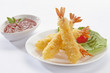Tempura Jumbo Shrimps with salad and salsa dip on white plate and white background