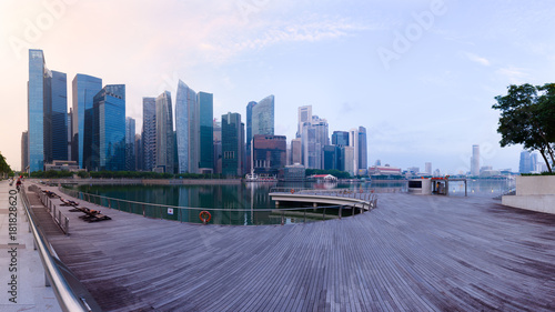 Cuadros en Lienzo Singapore's Central Business District skyline at sunrise, with high rise buildings and waterfront, from Marina Bay terrace deck