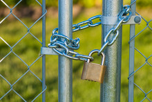 Chain And Lock On A Chainlink Fence