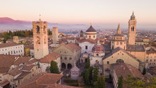 Bergamo, Italy. Drone Aerial View Of The Old City. One Of The Beautiful City In Italy. Landscape On The City Center And The Historical Buildings During The Sunset