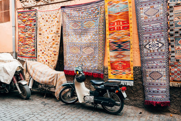 colorful carpets hanging at moroccan shops, marrakech