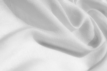 Texture, background, pattern. Fabric - silk light. Italian white fabric with white tones is a small floral pattern. Solid Silk Charmeuse fabric - light silver lining
