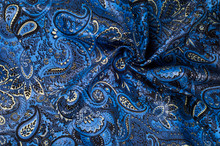 Background Texture, Fabric Blue Paisley. Designed For Fabri-Quilt, This Soft Double Napped  Flannel Is Perfect For Quilting, Apparel, And Home Decor Accents. Colors Include Black, Blue, And White.