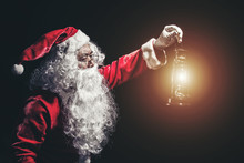 Santa Claus With A Lantern Isolated On White Background.