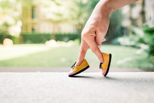 Woman Hand Finger Walking With Shoe Concept 