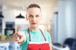 © Thunderstock - Mad wife wearing red apron pointing finger at camera