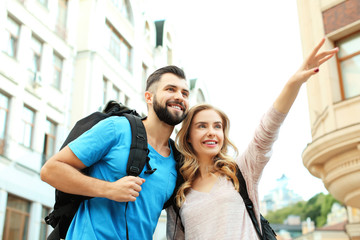 Wall Mural - Couple of young tourists on the street