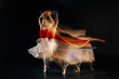 © zinkevych - My life. Nice well build beautiful woman moving her body and dancing while performing on stage