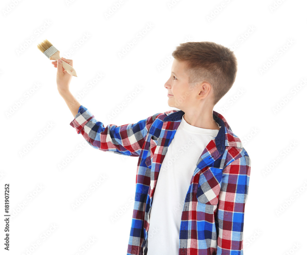 Cute little boy with brush painting against white background