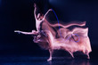 © zinkevych - Grace and elegance. Beautiful gracious skillful woman standing on stage and doing some dance movements while showing her performance