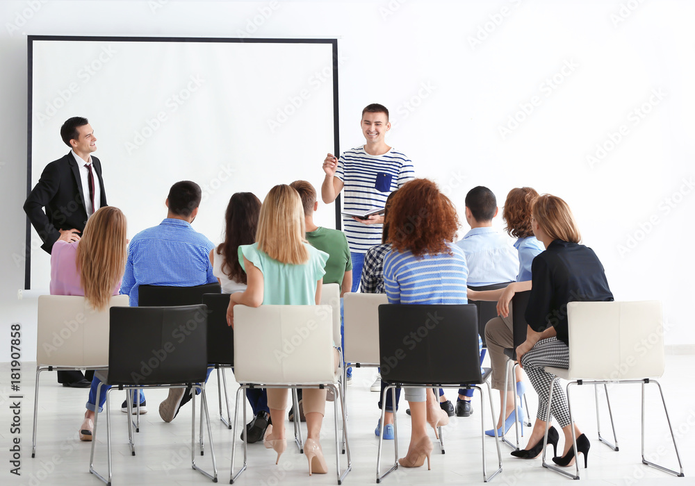 Group of people with business trainer at seminar
