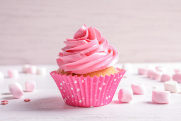 Poster - Yummy cupcake on light background