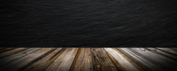 Aufkleber - Black stone wall background and wood table