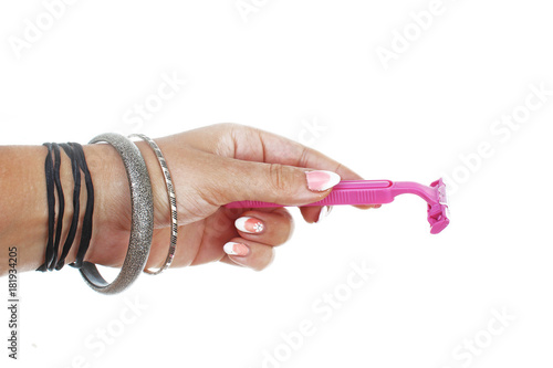 Fotografía Woman hand holding pink razor on isolated white cutout background