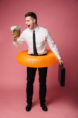 Poster - Happy emotional young businessman with rubber ring.