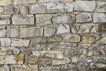 Wall Mural - Background old wall of large stones closeup