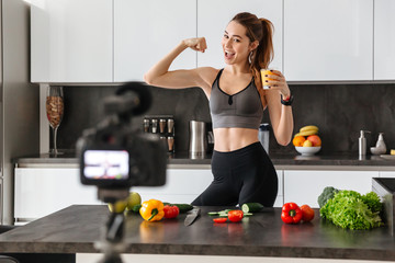 Fit healthy young girl recording her blog episode