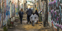 Family Walking In Street, Florentin, Tel Aviv, Israel