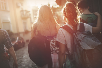 Tourist friends discovering city on foot