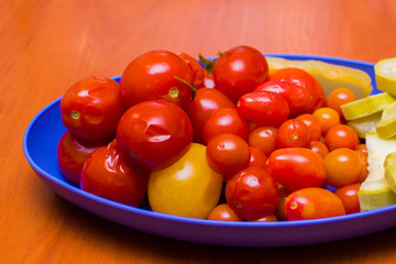 canned tomatoes and zucchini on a plate