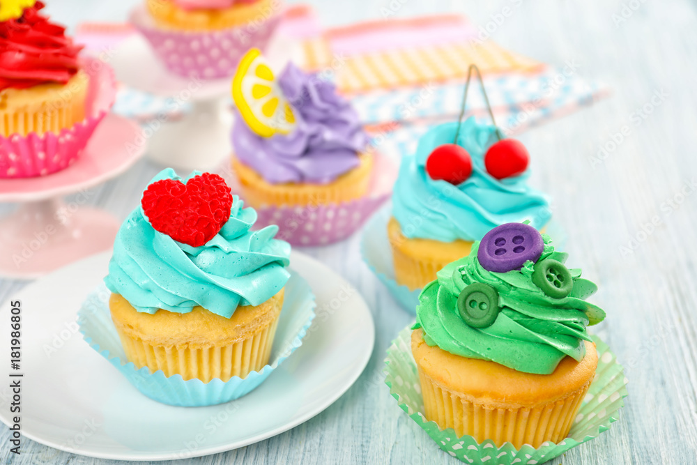 Beautiful cupcakes on wooden table