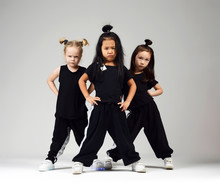 Group Of Three Young Girl Kids Hip Hop Dancers On Gray