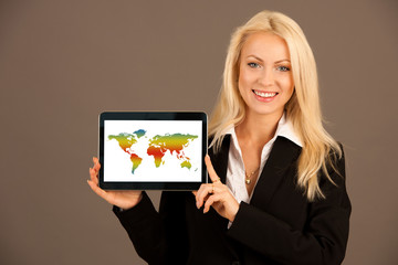 Beautiful blonde woman showing tablet with blank screen for additional text or graphic