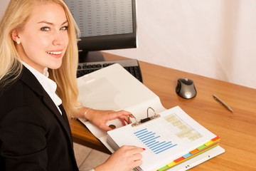 Sticker - Beautiful young woman check data in a work folder in her office