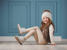 Cute Little Girl With Knitted Hat