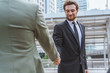 © bixpicture - Businessman shaking hands with partner. Concept of deal successful and negotiation agreement.