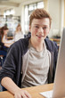 © Monkey Business - Portrait Of Male Student Working On Computer In College Library