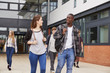 © Monkey Business - Group Of Students Walking Outside College Buildings
