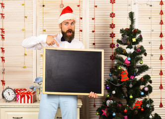 Poster - Man with beard holds blank blackboard and points at it