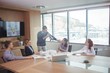 © WavebreakMediaMicro - Businessman using megaphone during meeting