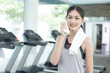 © Jestercine - Portrait of a young Attractive Asian Woman at Fitness Club. Woman with Exercise Concept.