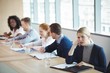 © WavebreakMediaMicro - Thoughtful businesswoman sitting with colleagues at desk