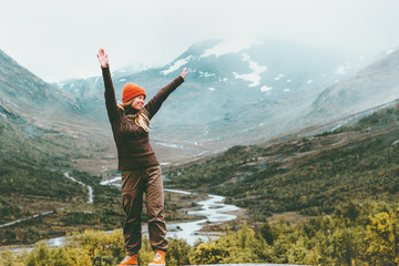 Wall Mural - traveling woman happy enjoying foggy mountains landscape outdoor emotions lifestyle success concept 