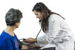 © sunlight19 - Doctor takes senior woman's arterial blood pressure over white background.  Health care